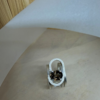 bague trombone argent quartz fume ovale vue dessus | 26 Passage, Créatrice de bijoux à Paris Silver ring with a textured, open-loop setting featuring a dark oval gemstone centerpiece