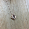 collier mikado vermeil zircon sur chaine | 26 Passage, Créatrice de bijoux à Paris Rose gold geometric pendant necklace with square frame and central diamond-like stone on a delicate chain.